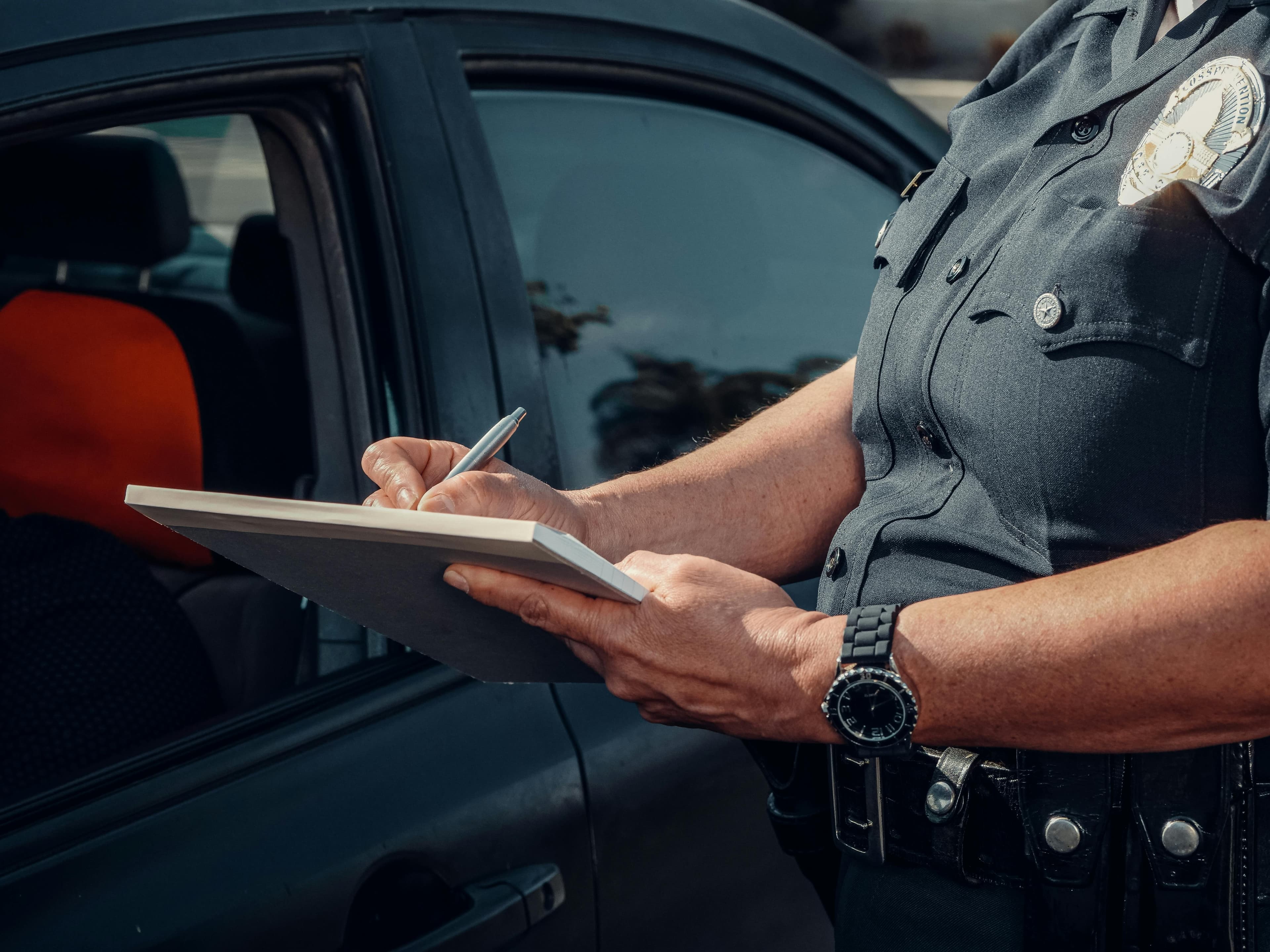 Police writing a citation.